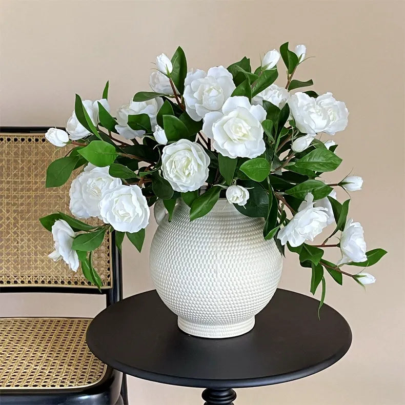 Single-stem artificial gardenia flower—decorative floral accent for dining tables, living rooms, bedrooms, and home interiors.