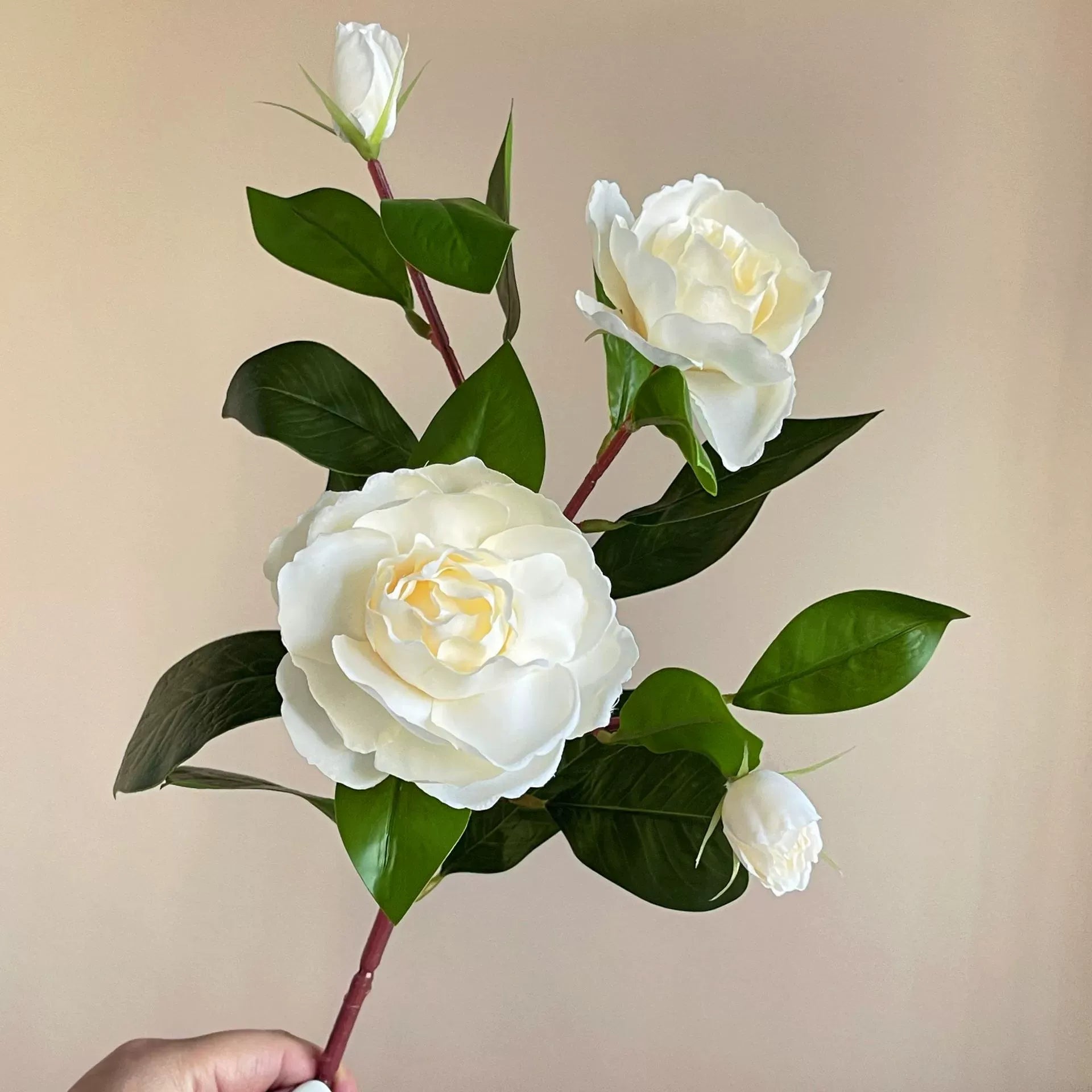 Single-stem artificial gardenia flower—decorative floral accent for dining tables, living rooms, bedrooms, and home interiors.