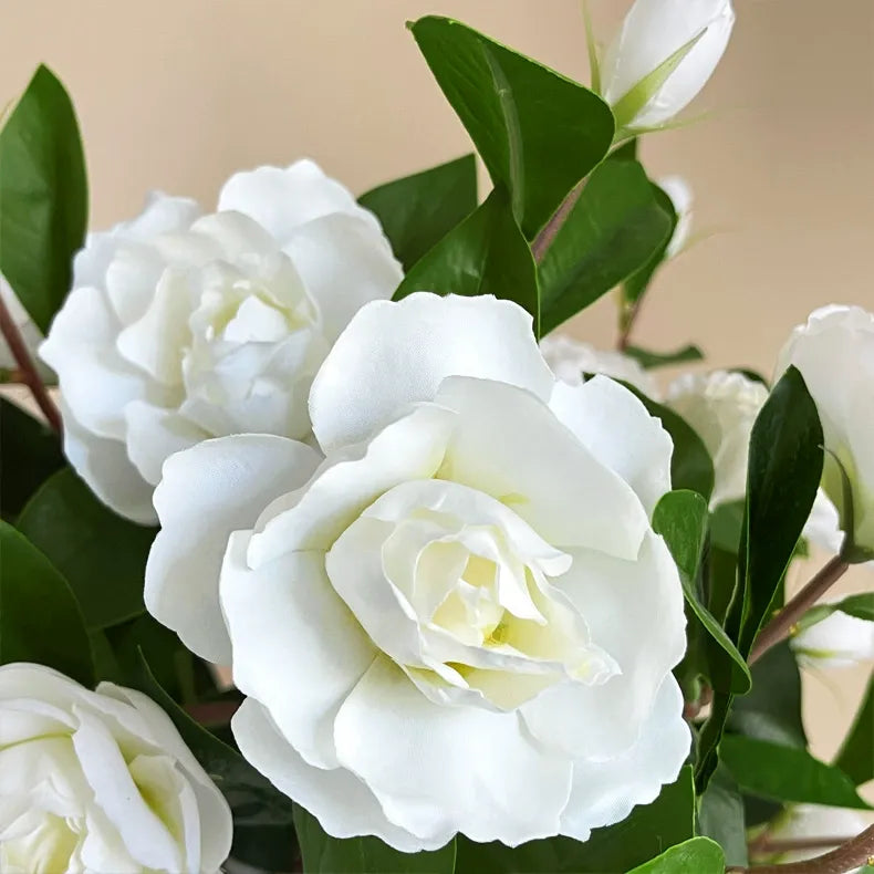 Single-stem artificial gardenia flower—decorative floral accent for dining tables, living rooms, bedrooms, and home interiors.