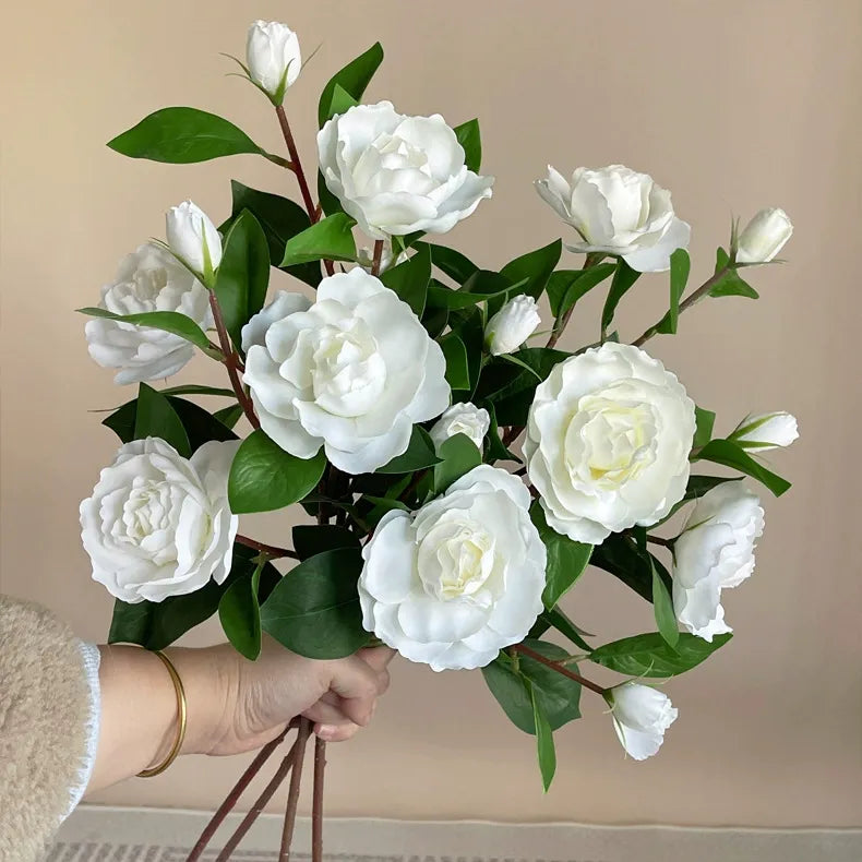 Single-stem artificial gardenia flower—decorative floral accent for dining tables, living rooms, bedrooms, and home interiors.