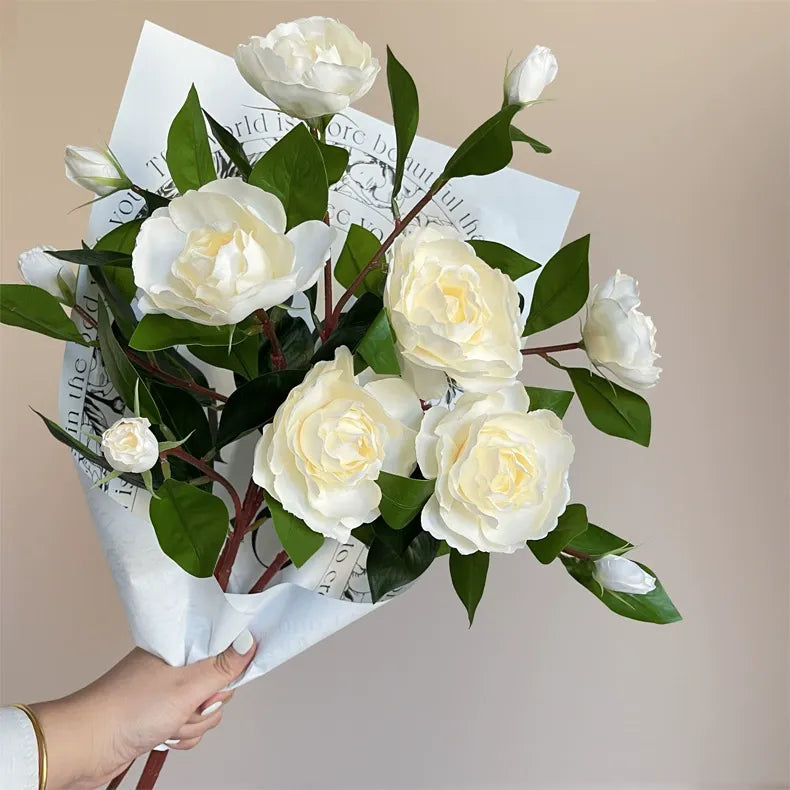 Single-stem artificial gardenia flower—decorative floral accent for dining tables, living rooms, bedrooms, and home interiors.